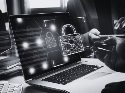 Hands on a laptop keyboard showing a picture of a padlock